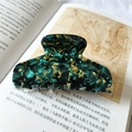 Detail of 9cm large marble pattern hair claw clip on vintage book background - Green Floral