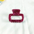 Close-up of small square acetate hair claw clip with purple marble texture pattern - Fuschia