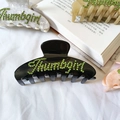 Grande molletta per capelli effetto marmo con scritta Thumbgirl in strass verdi lucidi - Nero