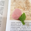 Pink tulip hair claw clip made of acetate with green leaves on a vintage book - Pink