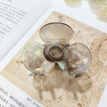 Elegant floral hair claw clip in pearlescent grey acetate with a spiral center - Transparent Grey