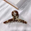 Large acetate hair claw clip with brown marble pattern on white fabric background - Dark Coffee Floral