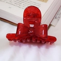 Translucent red acetate bow hair claw clip in vintage French style on a white fabric base - Red