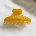 Amber yellow acetate hair claw clip with sparkling rhinestone stars and moon patterns - Turmeric