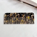 Portable wide-tooth acetate comb featuring a vintage brown tortoiseshell marble pattern - Brown Black Floral