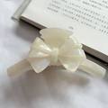 Elegant cream acetate bow hair claw clip with mother-of-pearl shimmer finish - Mermaid White