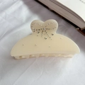 Elegant cream white acetate hair claw clip featuring a rhinestone bow design for women - Off White