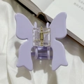 Close-up of lavender butterfly hair claw clip featuring matte texture and golden spring - Lavender