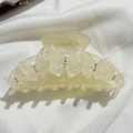 Macro shot of large creamy yellow acetate butterfly hair claw clip with crystal rhinestones - Mermaid Iridescent