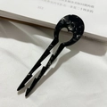 Detail of elegant black acetate hair fork with heart cutout and marble texture pattern - Black and Gray Floral / 9cm Medium