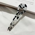 Macro detail of U-shaped acetate hair fork featuring black and white marble pattern - Black and White Speckled / 9cm Medium