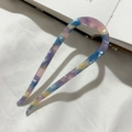 Detail view of U-shaped hair pin with purple and yellow marble texture on white fabric - Purple Blue Floral