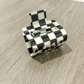 Classic black and white checkered PVC hair claw clip with glossy resin finish for women - Black