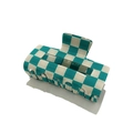 Detail view of a green and white checkered hair claw clip with a glossy resin finish - Blue Plaid