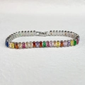 Detailed top view of rainbow cubic zirconia tennis bracelet with silver metal base - Platinum Color Multi Zirconia