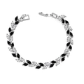 Primer plano de circonitas negras y blancas en una pulsera de plata con forma de hoja - 19cm (Con Extensión) / Oro Blanco Blanco y Negro