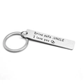 Macro detail of Drive Safe Uncle engraved stainless steel keychain with heart design - Uncle