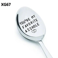 Detail macro shot of stainless steel spoon with humorous engraved text and heart symbol - Favorite Asshole Humor (XG67)