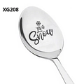 Macro detail of 'Let it Snow' laser engraving on a stainless steel Christmas spoon - Snowflake Pattern Style (XG208)