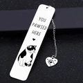Detail showing the stainless steel cat bookmark with heart charm on black background - Bookmark 2.6*13CM / Cow Cat Style (XK190-2)