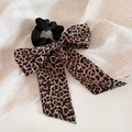 Detail of leopard print ribbon bow hair scrunchie with soft chiffon fabric texture - Leopard Print Ribbon Scrunchie