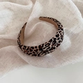 Retro leopard print wide headband with fabric texture on elegant linen background - Leopard Print