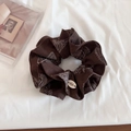 Detail of a vintage dark brown scrunchie with paisley pattern and BOTANI tag on white fabric - Coffee Paisley Slim Style