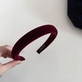 Detail shot of vintage dark red velvet sponge headband with luxury inner brand label - Wide Version / Burgundy