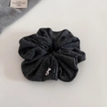 Detailed texture of grey knit scrunchie with a cute silver metal bear charm accent - Dark Grey Scrunchie