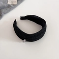 Close-up of black woolen headband with a delicate silver metal bear charm accent - Black Grey Headband