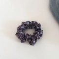 Detailed view of a vintage plaid scrunchie with blue, white, and reddish brown patterns - Purple Coffee Plaid