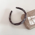 Detailed macro view of the vintage plaid sponge headband with a hand made interior label - Coffee Plaid