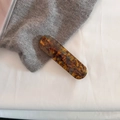 Detail of tortoise shell acetate hair clip with France Handmade lettering on knit fabric - Blue Coffee