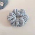 Detailed macro view of light blue lace scrunchie with intricate hollow weave texture - Light Blue