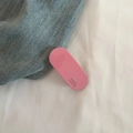 Detail of pink acetate hair clip with gold France Handmade lettering on white fabric - Pink