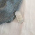 Detailed macro view of the oval iridescent resin hair clip with France Handmade lettering - Pearl White