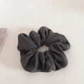 Detailed close-up of dark grey knitted scrunchie showing soft textured fabric folds - Light Gray