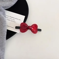 Detail view of a glossy red bow hair clip featuring a high-shine acetate finish - Hair Clip (1#) / Red