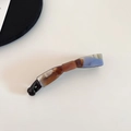 Detail shot of acetate banana hair clip featuring a stylish tortoiseshell pattern mix - Blue Orange Marble