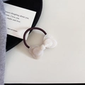 Close-up of a pearly white resin bow hair tie with a durable dark brown elastic band - Hair Tie (7#)