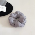 Close-up of light grey ribbed knit scrunchie with soft pleated texture for women - Large / Gray
