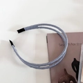 Detail view of the light blue double-layered satin headband with soft protective end caps - 2# Blue