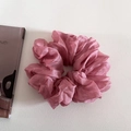 Macro shot of large dusty rose organza scrunchie with layered pleated texture - Berry Pink