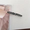 Detail of a vintage cow pattern hair clip with gold lettering on a white background - Black White Polka Dot