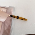 Detail of tortoiseshell acetate hair clip with Barrette La France gold lettering - Dark Tortoiseshell