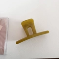 Macro view of olive green hair claw clip in glossy resin with hollow arched design - Straight Style - Green