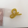 Detailed top view of olive green translucent hair claw clip with golden metal spring - Bow Style - Green