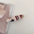 Macro detail of oval acetate hair clip featuring cream and reddish-brown marble texture - 6# Deep Milk Coffee