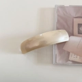 Detail of handmade cream acetate hair clip showing high-gloss finish and French craft - Milky Apricot