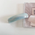 Detail view of light blue marble acetate hair clip with gold France engraving - Light Blue Striped